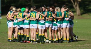 A Womens team from the University Football Club linking arms 